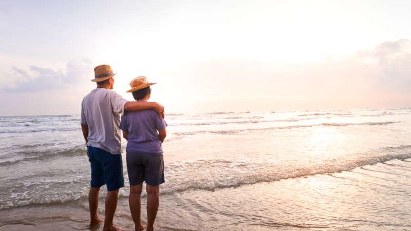 elderly-asian-couple-stand-together-beach-look-beautiful-sea-morning-together-travel-concept-live-happily-retirement-age-copy-space-800