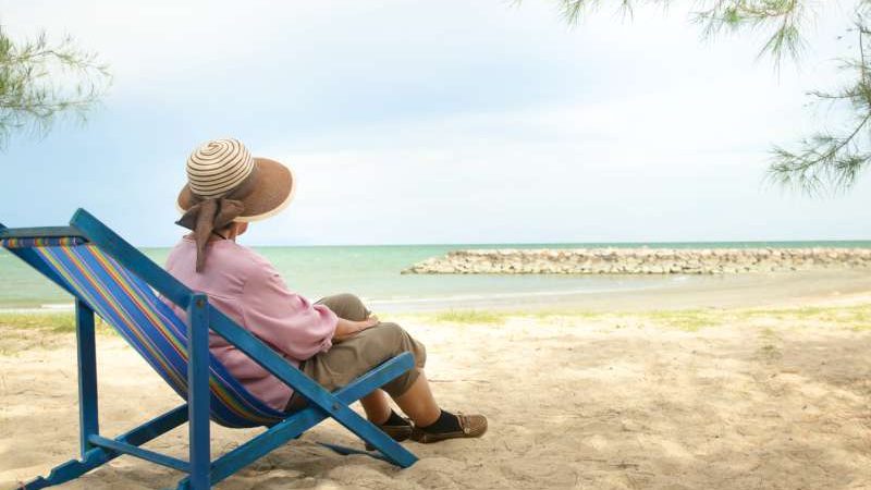 elderly-asian-woman-hat-sits-deck-chair-by-beach-concept-elderly-travel-nature-during-retirement-age-copy-space-800