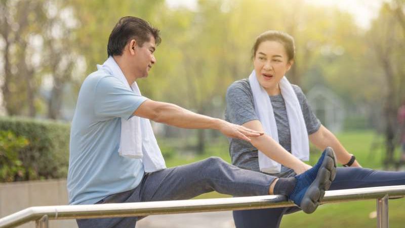 retired-couple-exercising-happily-healthy-retirement-age-exercise-elderly-life-insurance-800