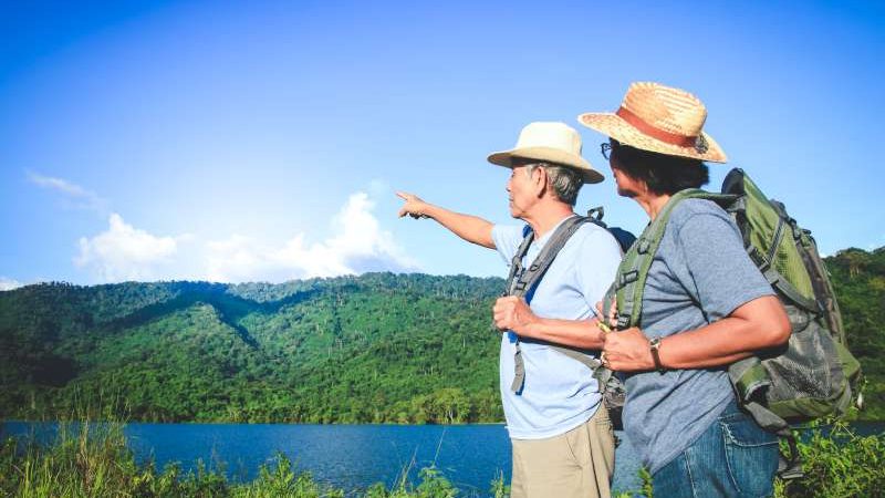 senior-asian-couple-trekking-traveling-living-happy-life-retirement-healthy-can-see-fresh-nature-concept-health-tourism-elderly-with-copy-space-800